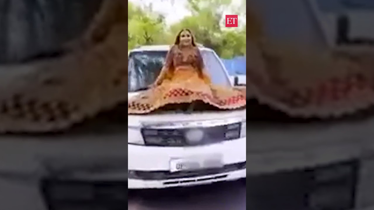 Viral Video: Prayagraj Bride Poses On Moving Car’s Hood, Faces Hefty Fine | Econ Times