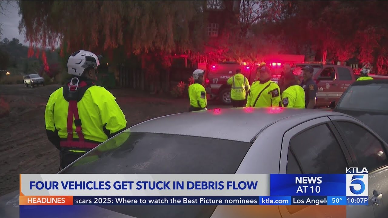 Mud and debris flow strands motorists in Woodland Hills