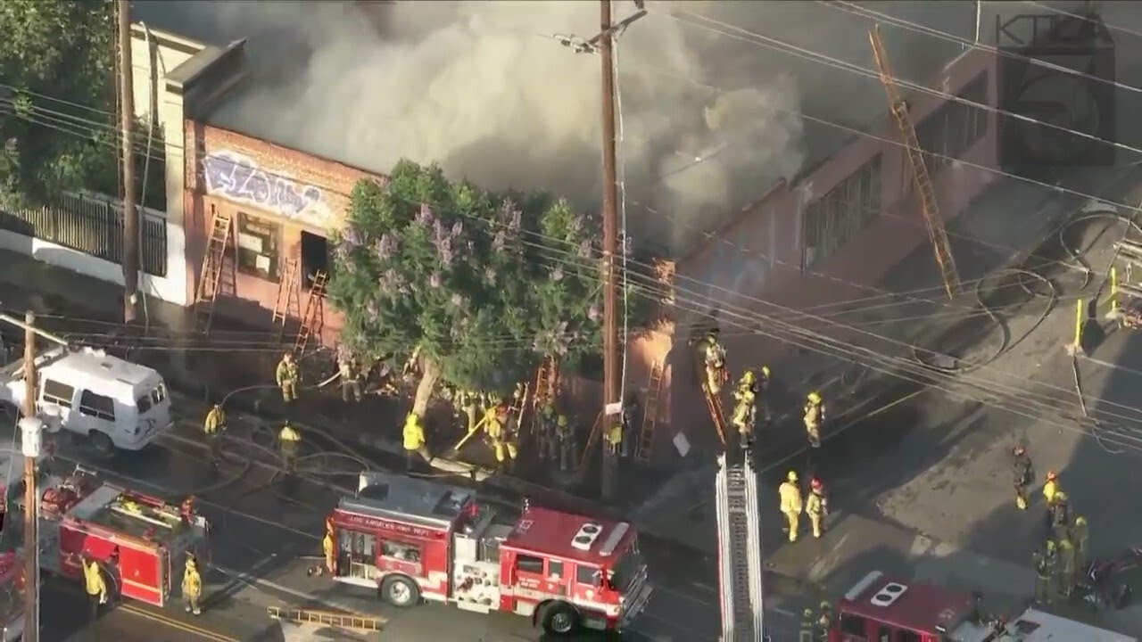 Large Fire Engulfs Commercial Building In South Los Angeles