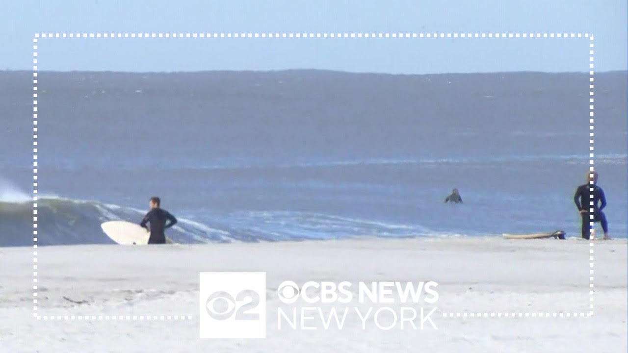 Early Morning Surfers Enjoy High Swells From Hurricane Lee