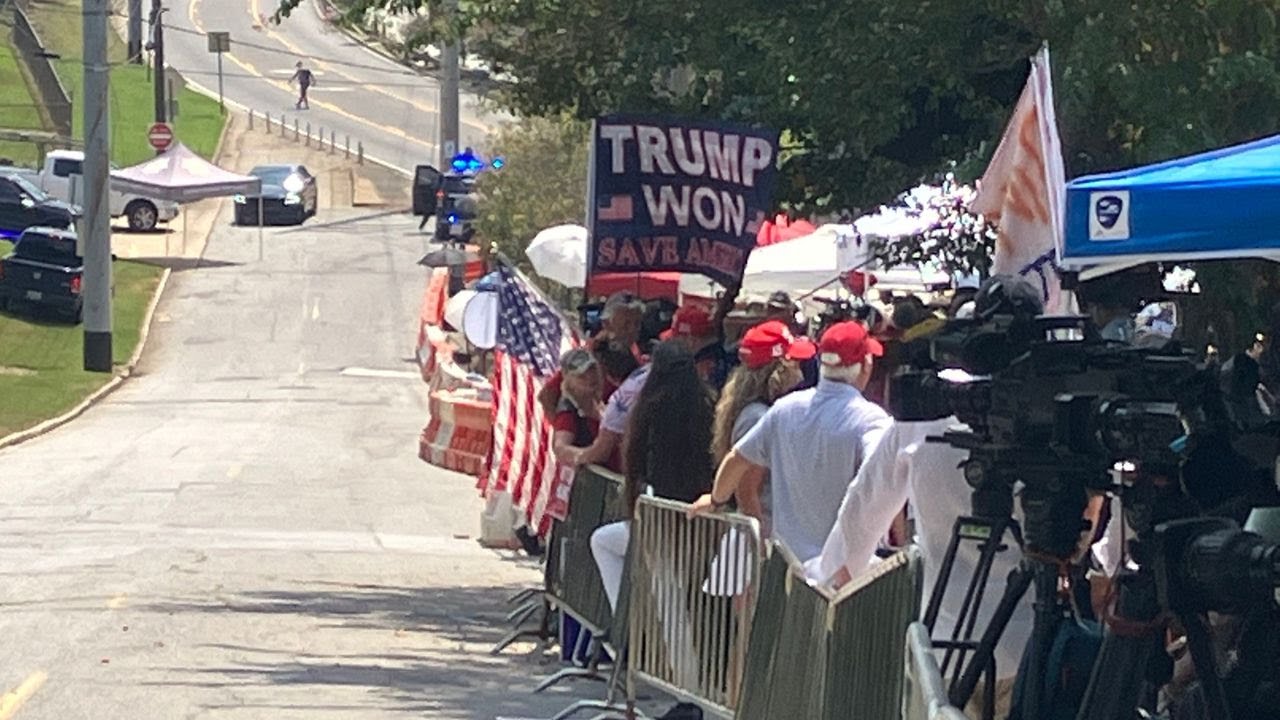 Trump Supporters, Dissenters Gather Outside Fulton County Jail Ahead Of Surrender