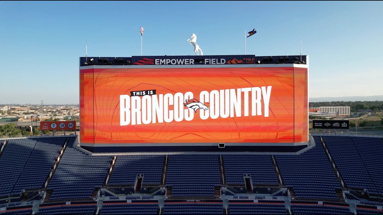 Steve Atwater, Miles The Mascot Reveal New Empower Field At Mile High Scoreboard